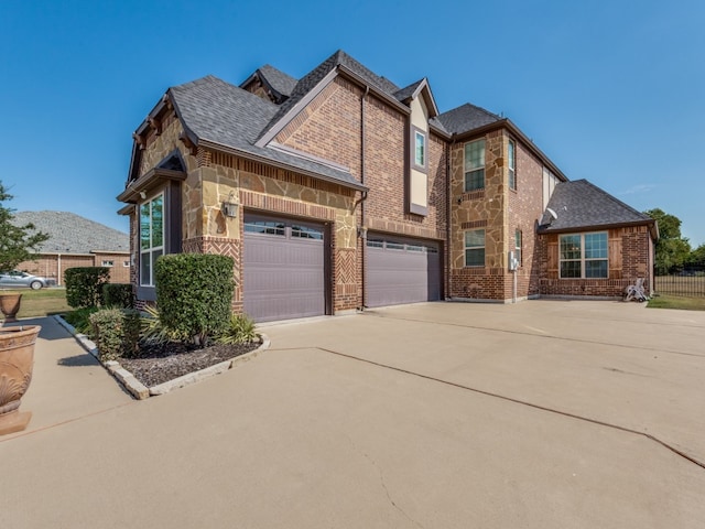 view of side of home with a garage