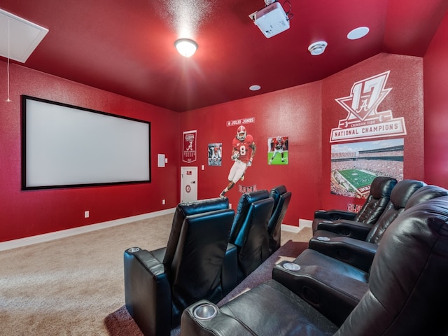 carpeted home theater room featuring lofted ceiling