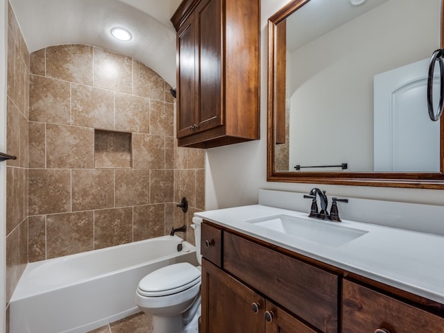 full bathroom with tile patterned flooring, vanity, lofted ceiling, toilet, and tiled shower / bath combo