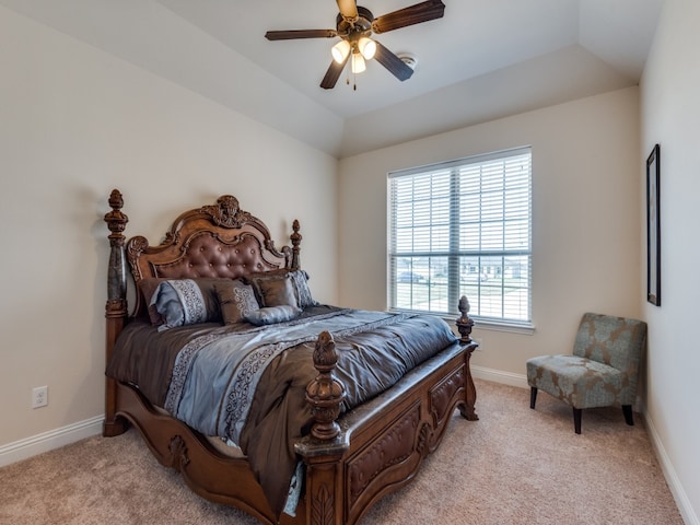 carpeted bedroom featuring lofted ceiling and ceiling fan