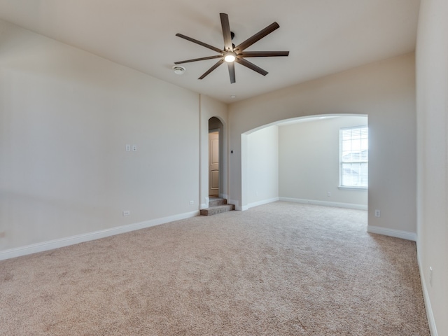 carpeted empty room with ceiling fan