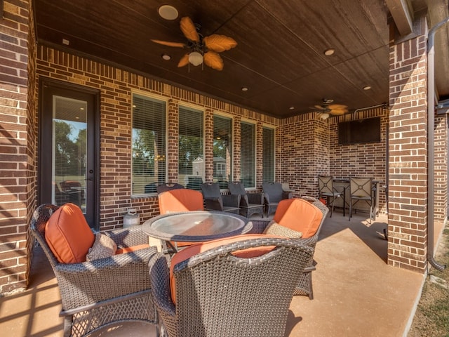 view of patio featuring ceiling fan