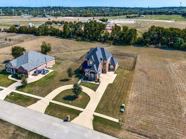 birds eye view of property with a rural view