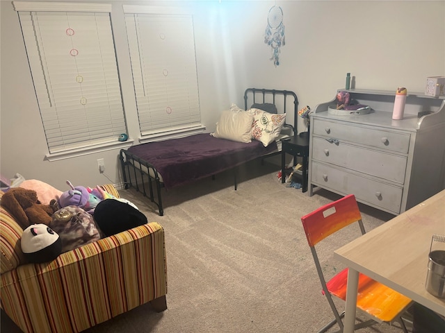 bedroom featuring light colored carpet