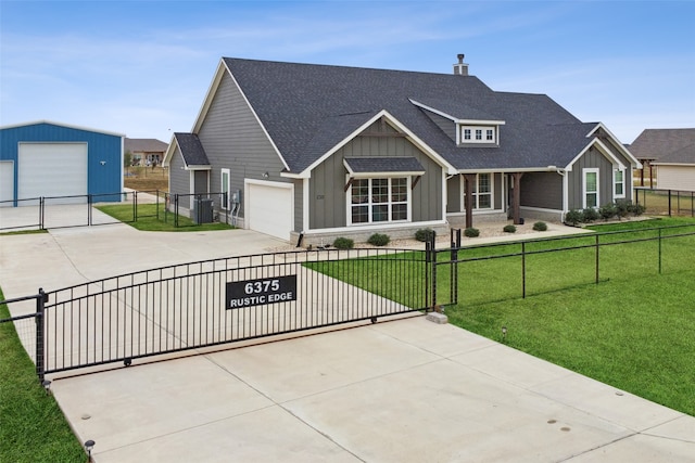 view of front facade featuring a front yard and a garage