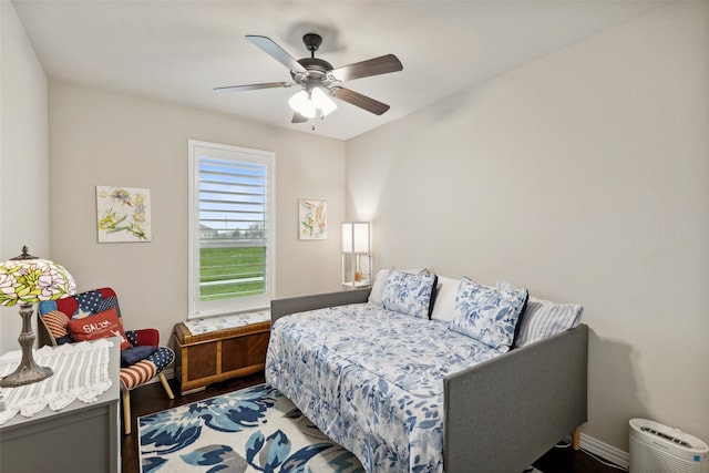 bedroom with hardwood / wood-style floors and ceiling fan