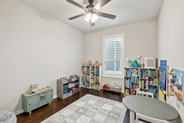 rec room featuring ceiling fan and dark hardwood / wood-style flooring