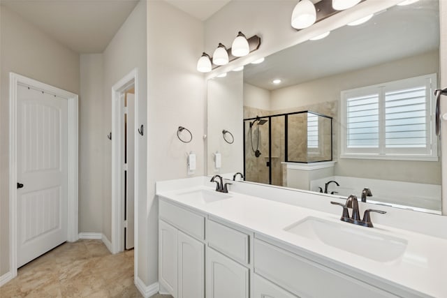 bathroom with shower with separate bathtub and vanity