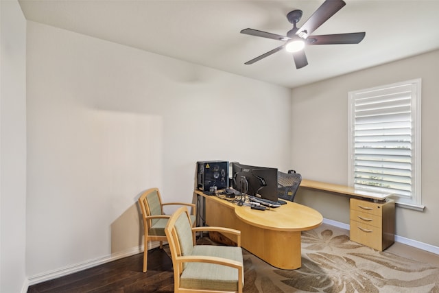 office area featuring dark wood-type flooring and ceiling fan