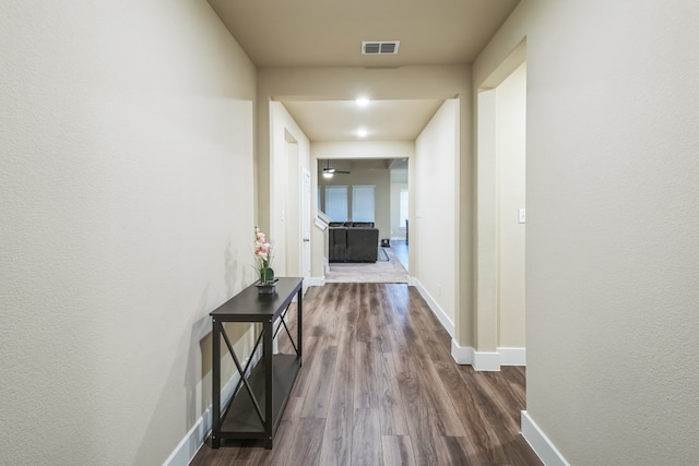 hallway featuring hardwood / wood-style flooring