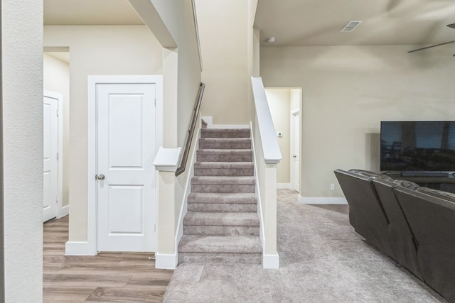 stairway featuring wood-type flooring