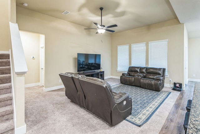 living room featuring light hardwood / wood-style floors and ceiling fan