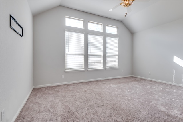 additional living space featuring ceiling fan, lofted ceiling, and light carpet