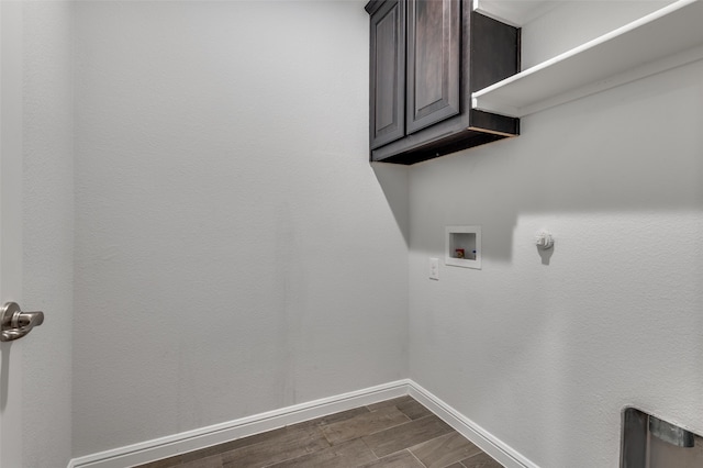 laundry room with cabinets, washer hookup, and hookup for a gas dryer