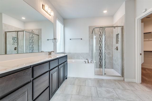 bathroom featuring vanity and separate shower and tub