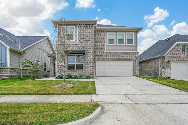 view of front of property with a garage and a front lawn