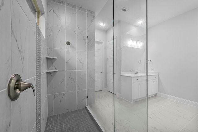 bathroom with vanity and tiled shower