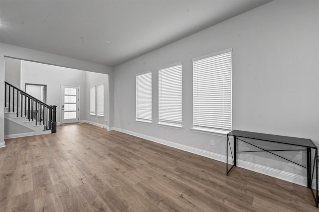 unfurnished living room featuring hardwood / wood-style floors