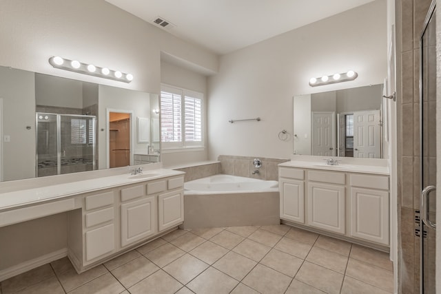 bathroom with vanity, tile patterned floors, and plus walk in shower