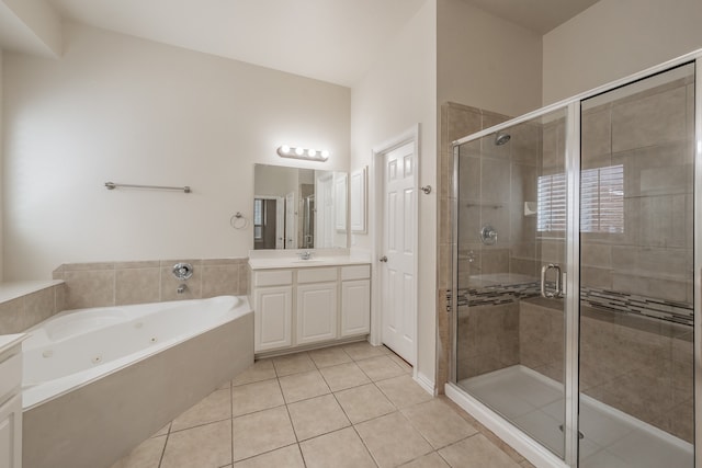 bathroom featuring independent shower and bath, vanity, and tile patterned floors