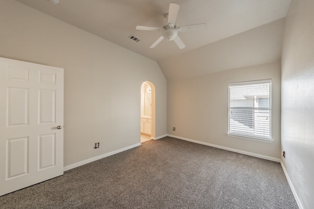 unfurnished room featuring carpet, vaulted ceiling, and ceiling fan