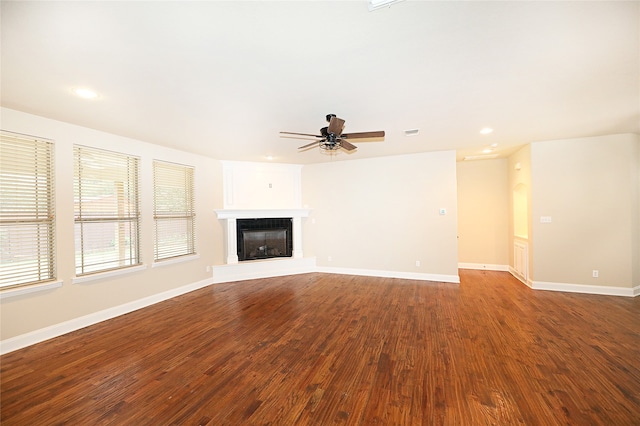 unfurnished living room with hardwood / wood-style floors and ceiling fan