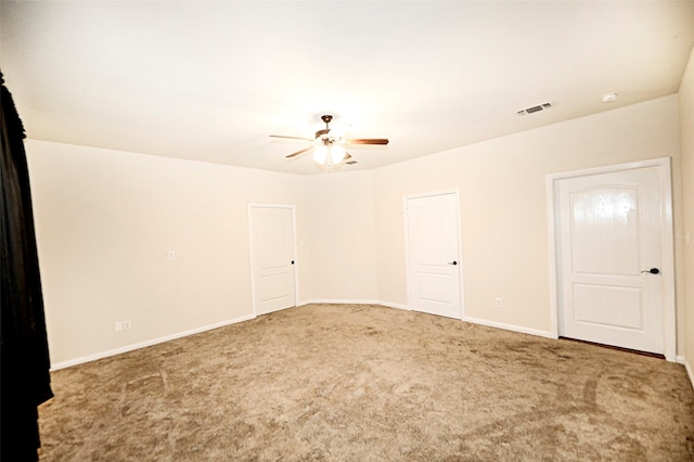 unfurnished room with carpet and ceiling fan