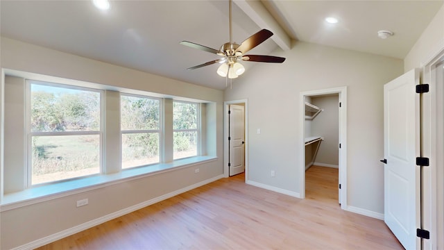 unfurnished bedroom featuring multiple windows, ceiling fan, and light hardwood / wood-style flooring