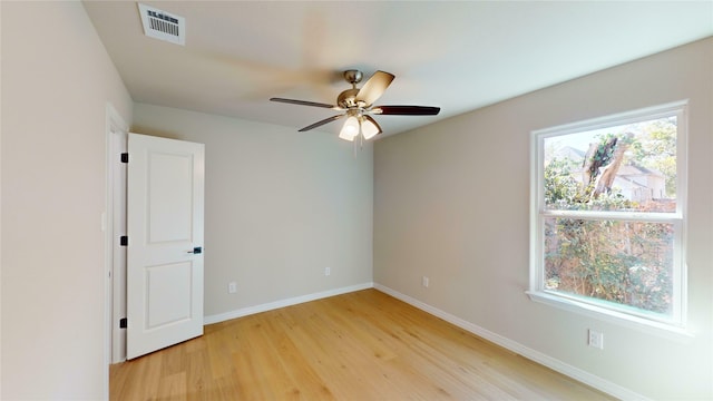 703 Cedar St, Cleburne, TX 76031 - empty room featuring light wood-style flooring, baseboards, and a ceiling fan