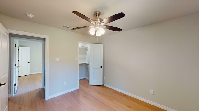 unfurnished bedroom with light wood-type flooring and ceiling fan