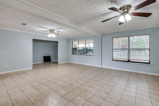 interior space with ornamental molding, a textured ceiling, ceiling fan, and light tile patterned floors