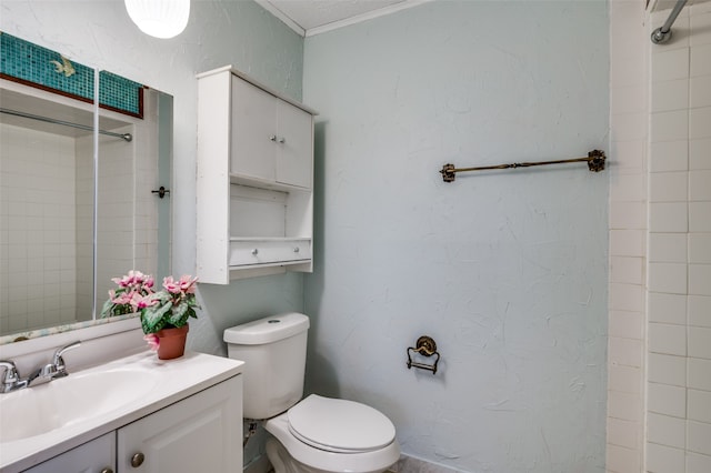 bathroom with vanity, toilet, and a tile shower