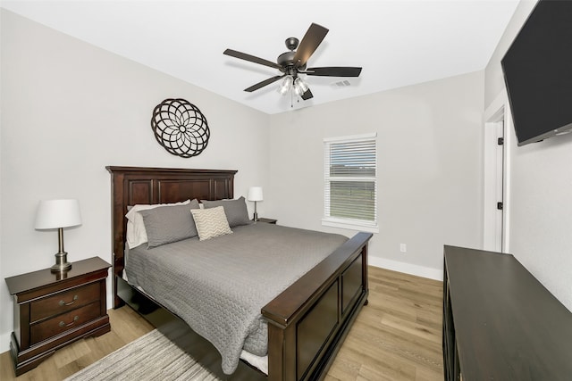 bedroom with light wood-type flooring and ceiling fan