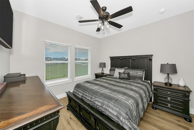 bedroom featuring ceiling fan and light hardwood / wood-style flooring