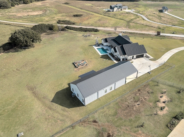 birds eye view of property featuring a rural view