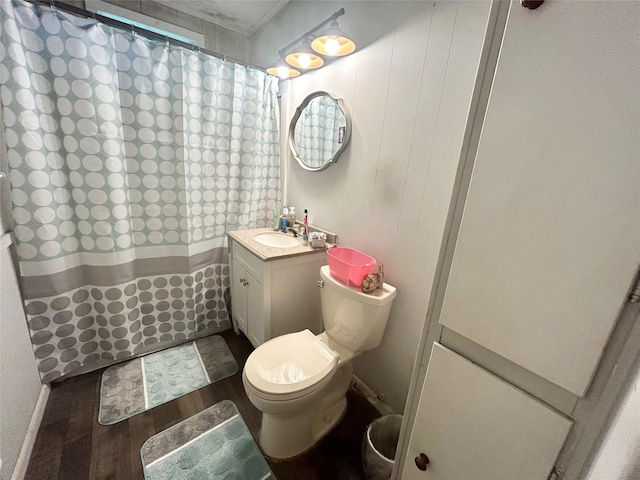 bathroom featuring curtained shower, vanity, toilet, and wood-type flooring