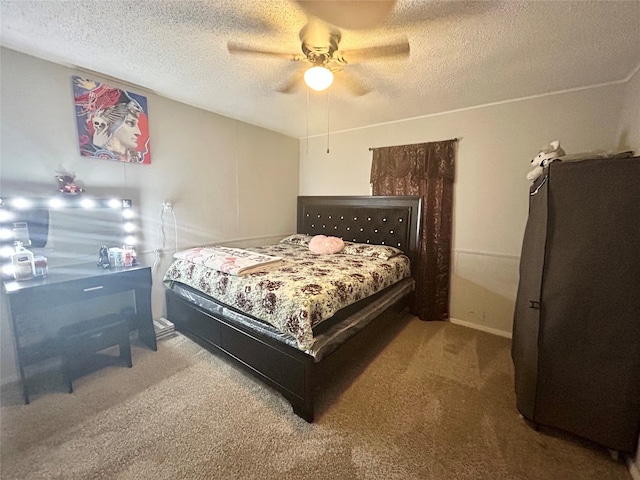 bedroom with ceiling fan, a textured ceiling, and carpet floors