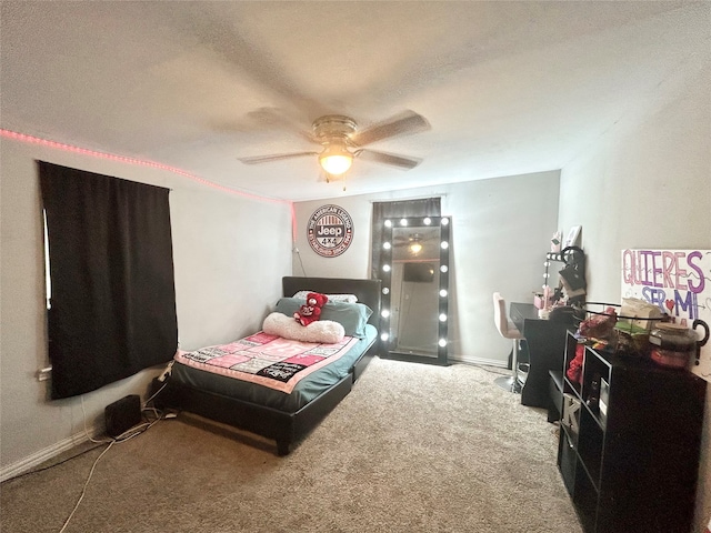 carpeted bedroom with a textured ceiling and ceiling fan