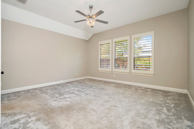 spare room featuring ceiling fan, carpet flooring, and lofted ceiling