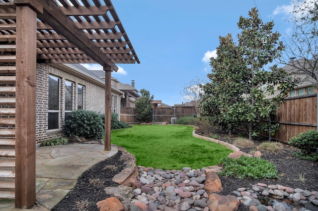 view of yard with a pergola and a patio area