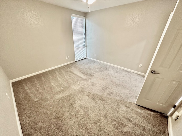 unfurnished room featuring carpet floors and ceiling fan