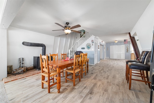 dining room featuring ceiling fan and light hardwood / wood-style floors