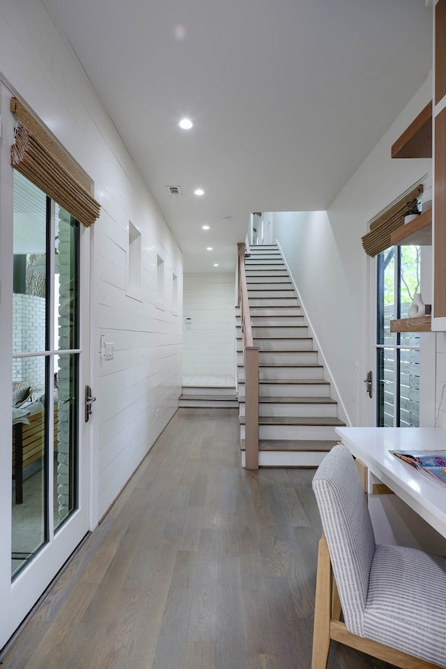 stairs featuring wood-type flooring