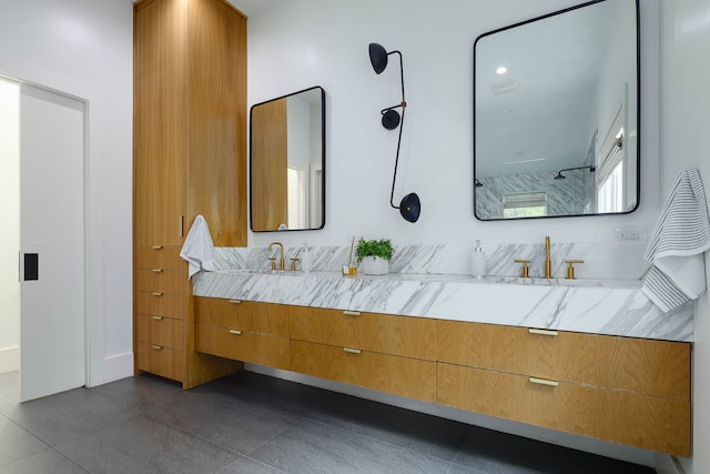 bathroom with walk in shower and vanity