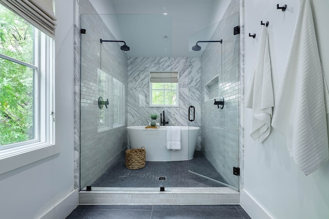 bathroom featuring a wealth of natural light, tile patterned flooring, and separate shower and tub