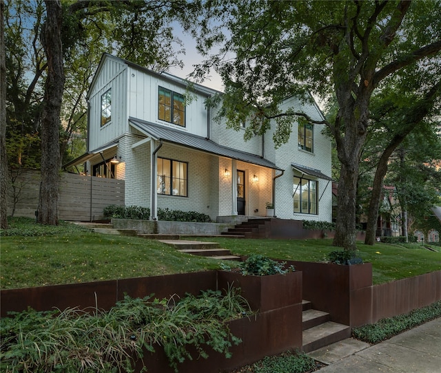 view of front of house with a lawn