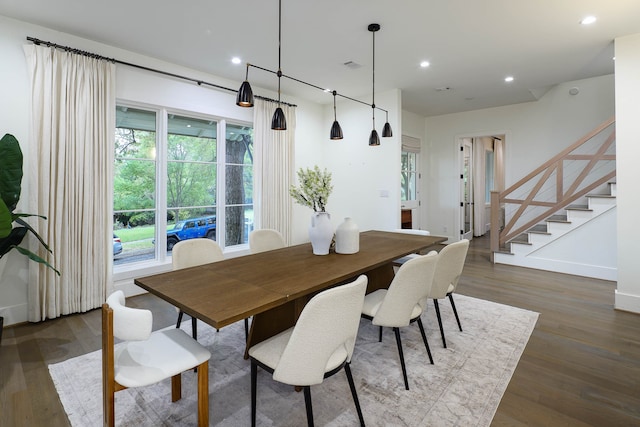 dining area with dark hardwood / wood-style floors