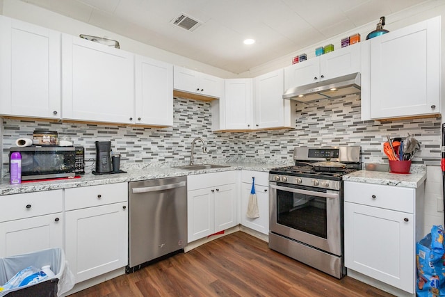 kitchen featuring sink, white cabinets, tasteful backsplash, and appliances with stainless steel finishes