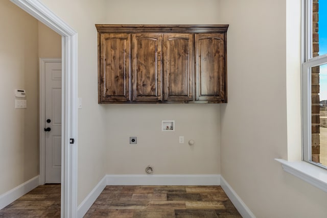 clothes washing area with cabinets, washer hookup, dark hardwood / wood-style floors, hookup for an electric dryer, and hookup for a gas dryer