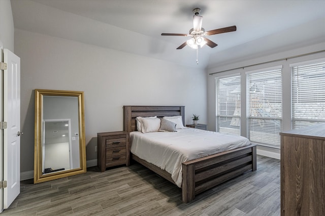 bedroom featuring hardwood / wood-style floors and ceiling fan